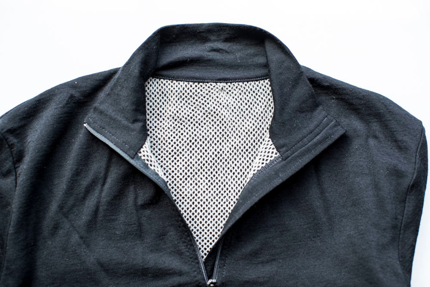 Merino long sleeve 1/4 zip top, in the colour black.